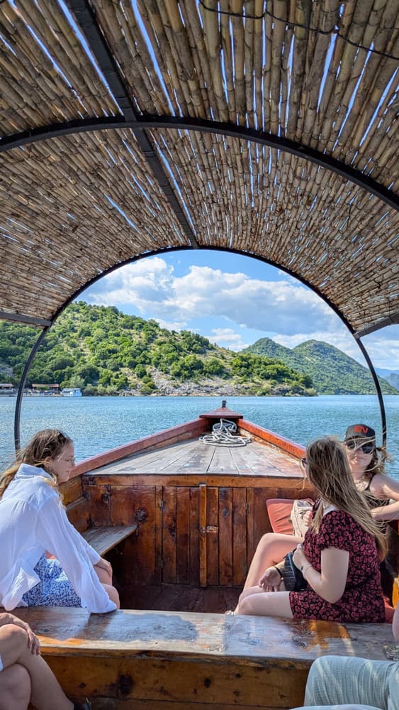 Boat on Skadar Lake at golden hour